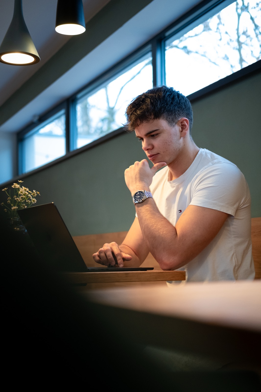 Daniel Kolář working on a laptop